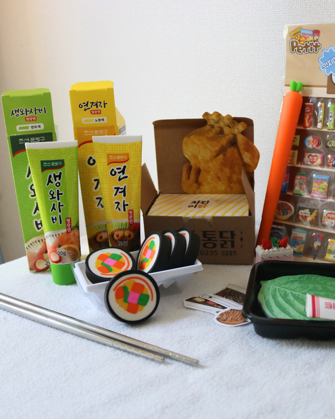 Assorted Korean BBQ Stationery Goods like Sauce Shaped Highlighters, a Carrot Gel Pen, Food Shaped Stickers, and more 