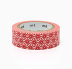 A roll of washi tape with a red geometric star pattern on a light pink base, shown on a clean white background. The brand name 'mt' is partially visible on the inner cardboard core.