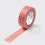 A roll of decorative washi tape with a repeating red geometric starburst pattern on a light pink background, shown with one strip unrolled against a light gray background.