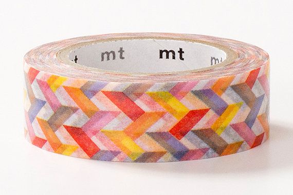 A roll of washi tape with a colorful chevron pattern in red, orange, yellow, purple, pink, and brown, displayed on a clean white background.