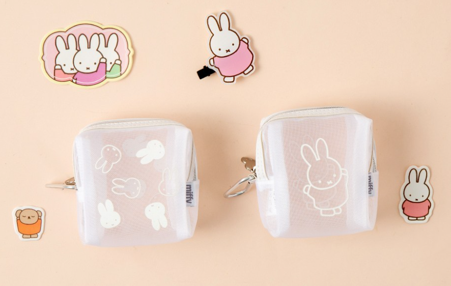 A white mesh miffy pouch with zip up for makeup and travel purposes